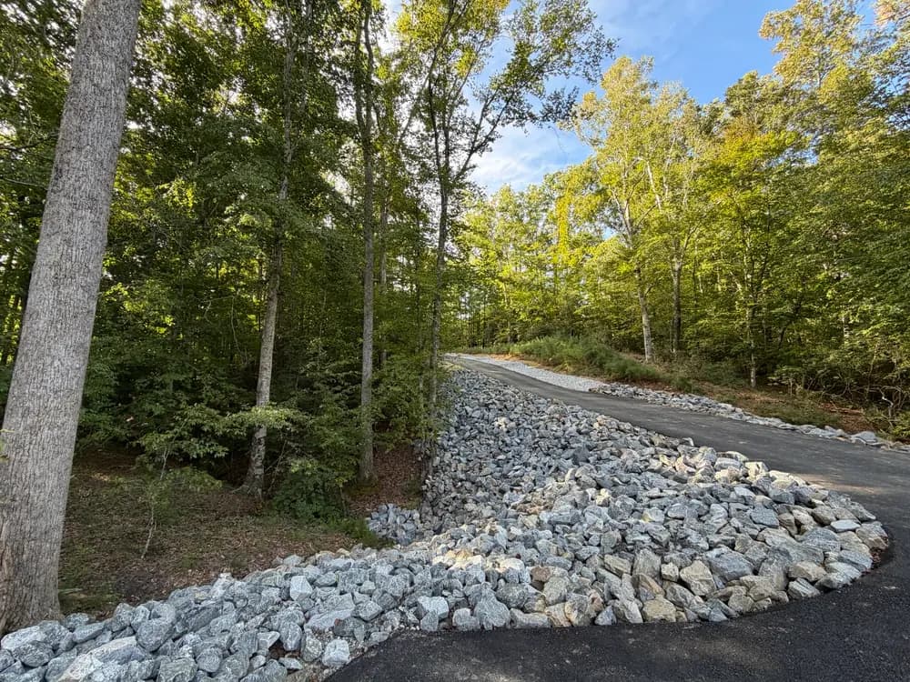 Fixing a Builder's Rip Rap Mistake on a Sloped Driveway in James City County image